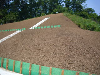 Blowing wood chips on the slope